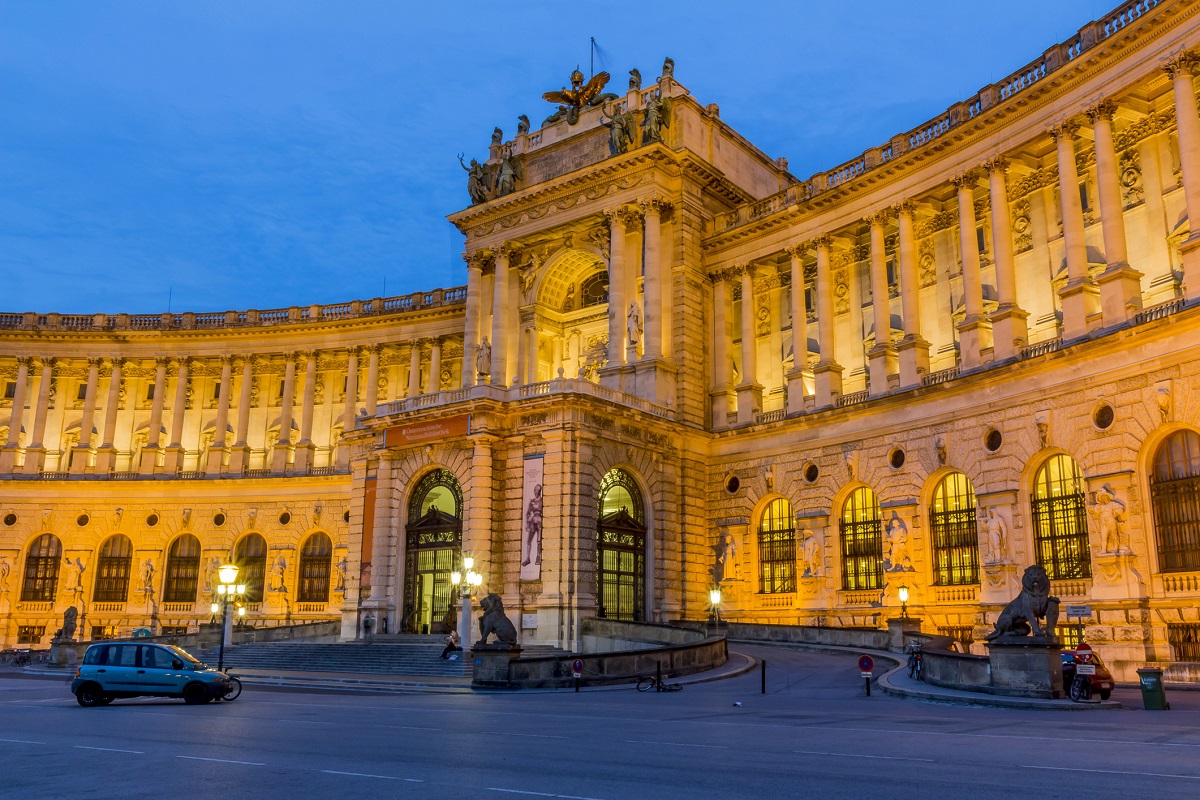 The floodlit facade of the Hofburg at night