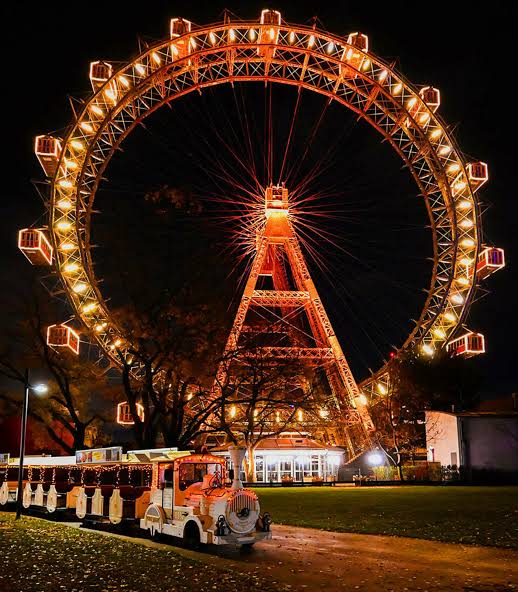 The Riesenrad lit up at night in the Prater