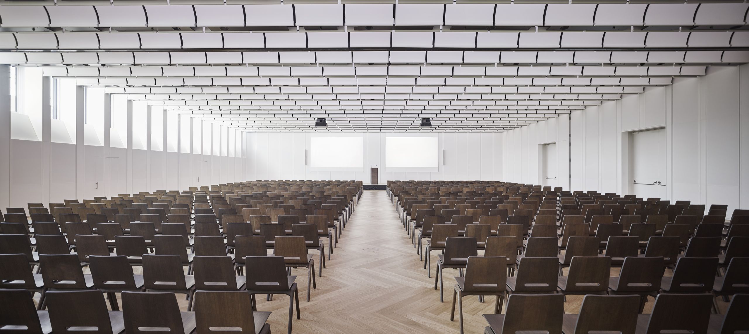 The Lower Belvedere conference room laid out in theatre style under its white slatted ceiling